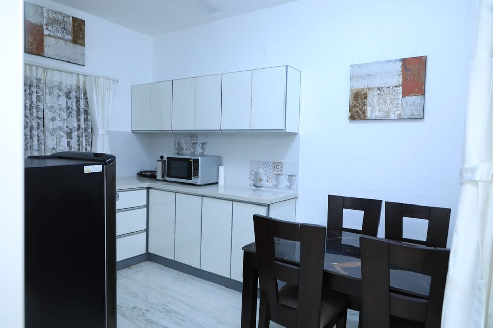 Toaster, cleaning supplies, freezer, dining tables