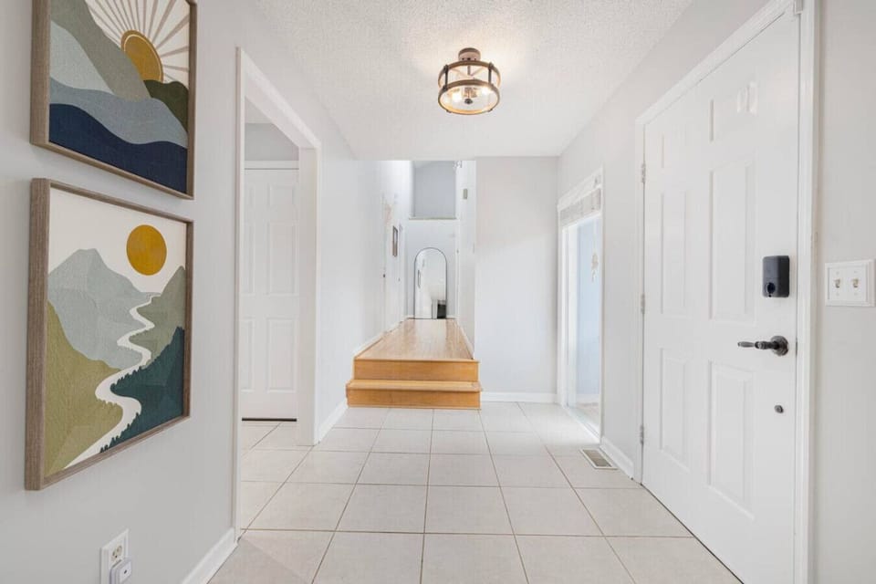 The bright hallway leads to the three bedrooms and 2 full bathrooms