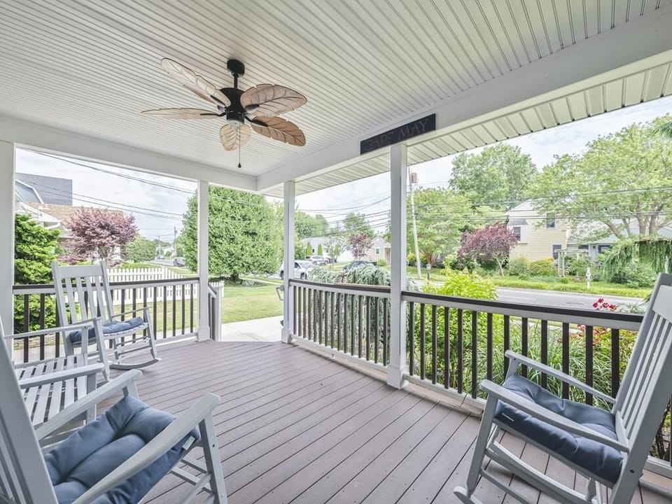 Soak in the tranquil surroundings from this spacious porch, adorned with stylish seating and charming decor, ideal for enjoying the sun or evening relaxation.