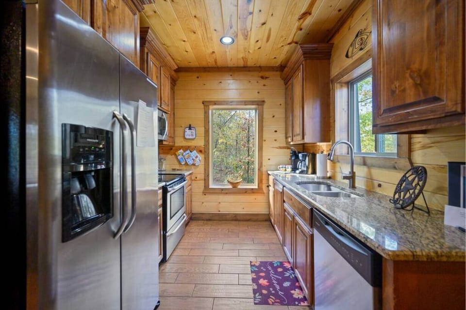 Spacious cabin kitchen with stainless steel appliances