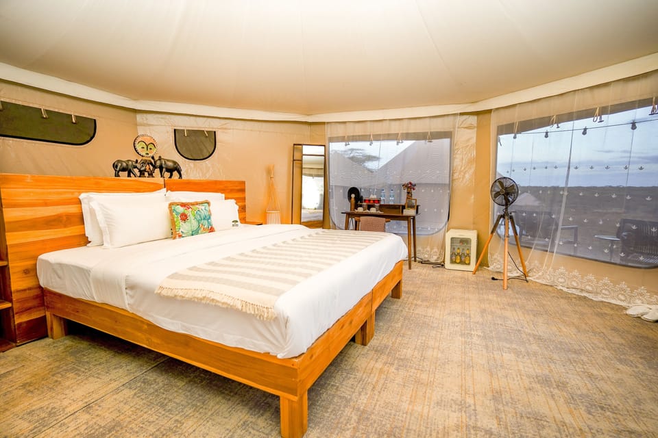 Desk, laptop workspace, bed sheets