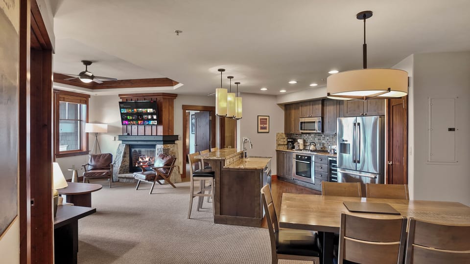 Warm, open living space with plush seating and modern lighting