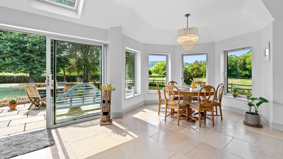 Sunlight pours through skylights and wide windows, keeping the space airy and bright.