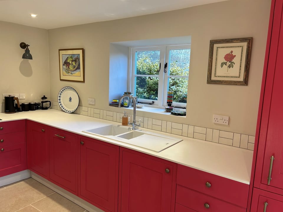 The Kitchen has an Induction hob, large Fridge freezer, dishwasher and washing machine