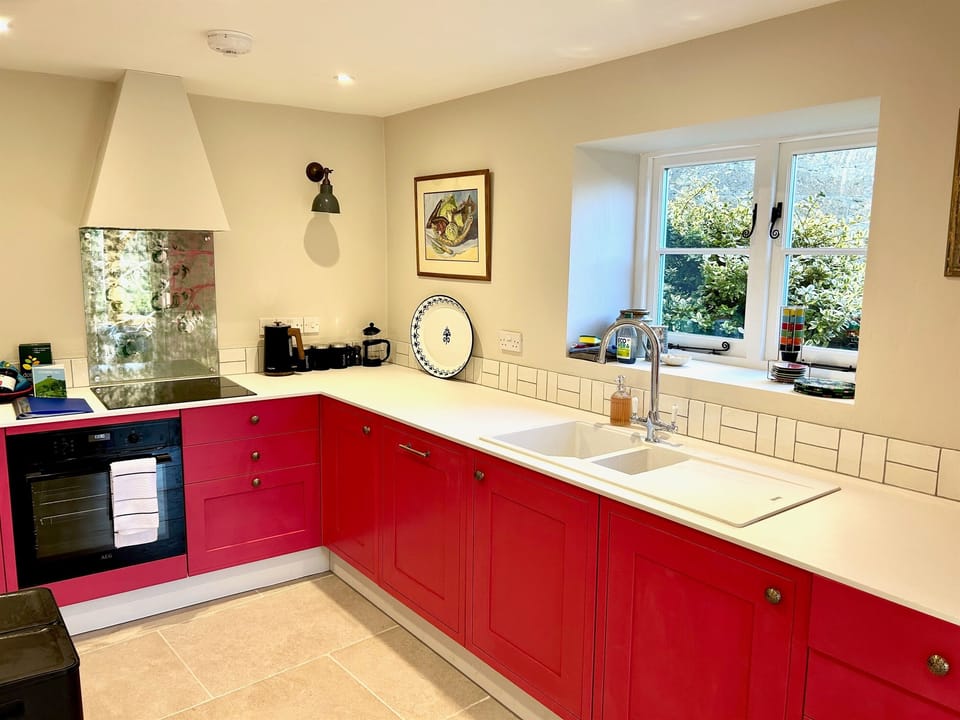 The Kitchen has an Induction hob, large Fridge freezer, dishwasher and washing machine