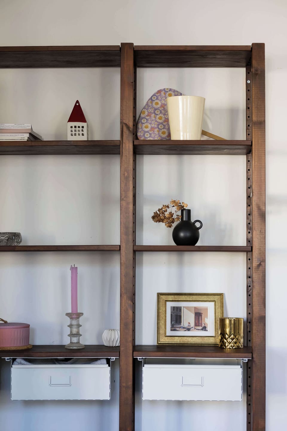 The open shelving unit with books and toys helps keep the room tidy and makes favorite items easily accessible.