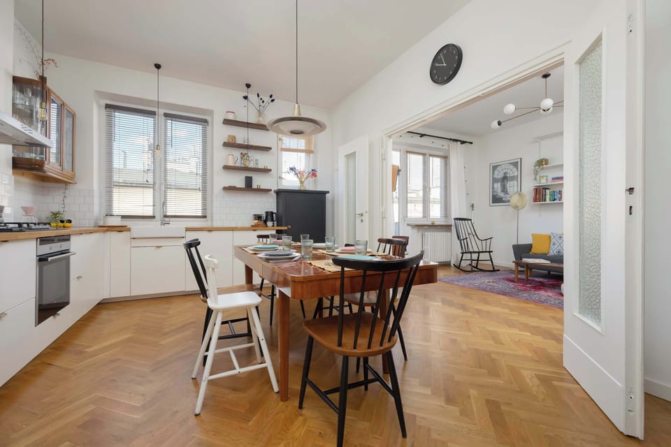 The open-plan kitchen connected with the dining area and living room brings functionality and lets you enjoy time together in one space.