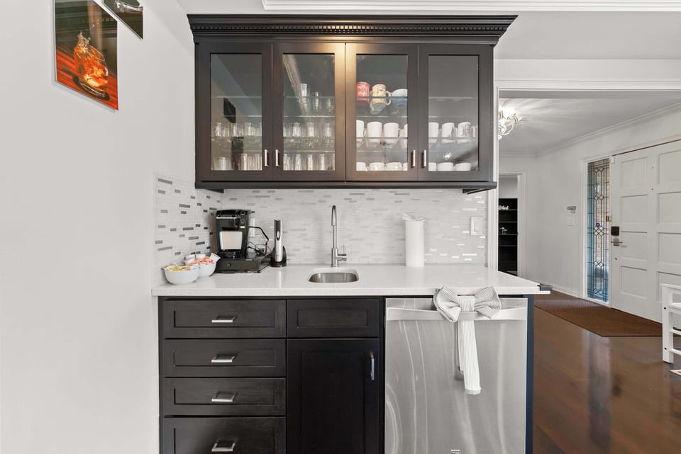 The dining room’s wet bar is ideal for whipping up after dinner coffee & cocktails​