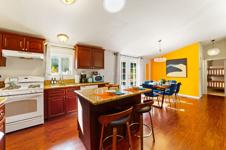 Bright open-concept dining and kitchen space designed for effortless cooking, dining, and gathering.