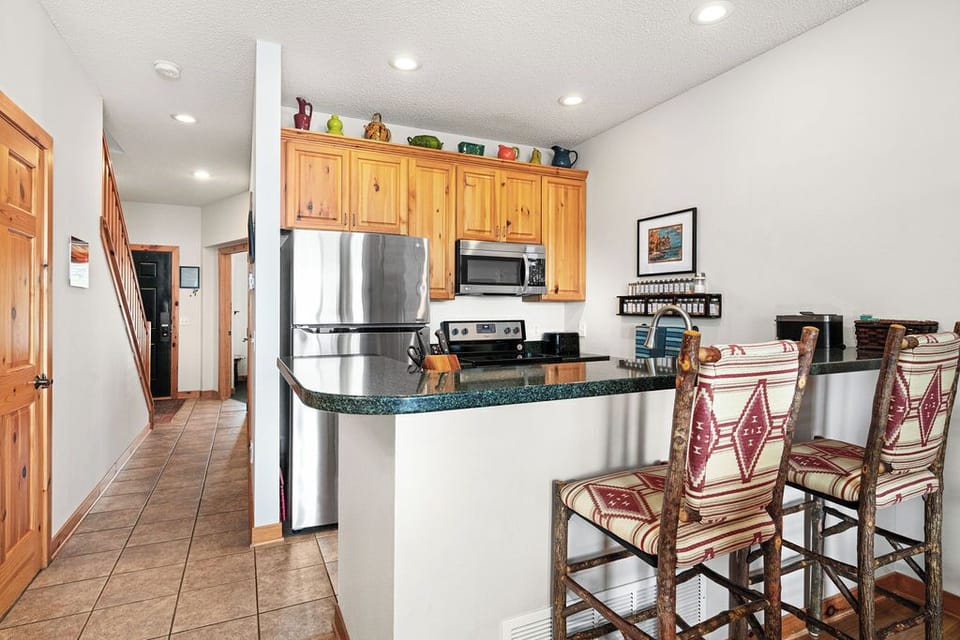 Kitchen - cupboards are loaded with dishes and organized to find things. 