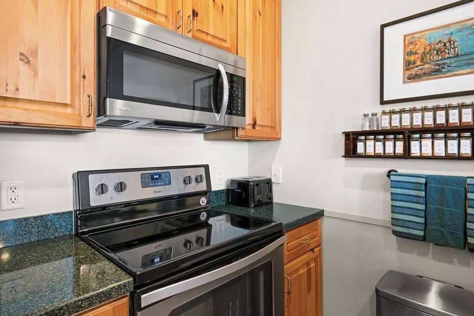 Kitchen - Full size stove & Refrigerator - Dishwasher - Keurig Duo coffee maker