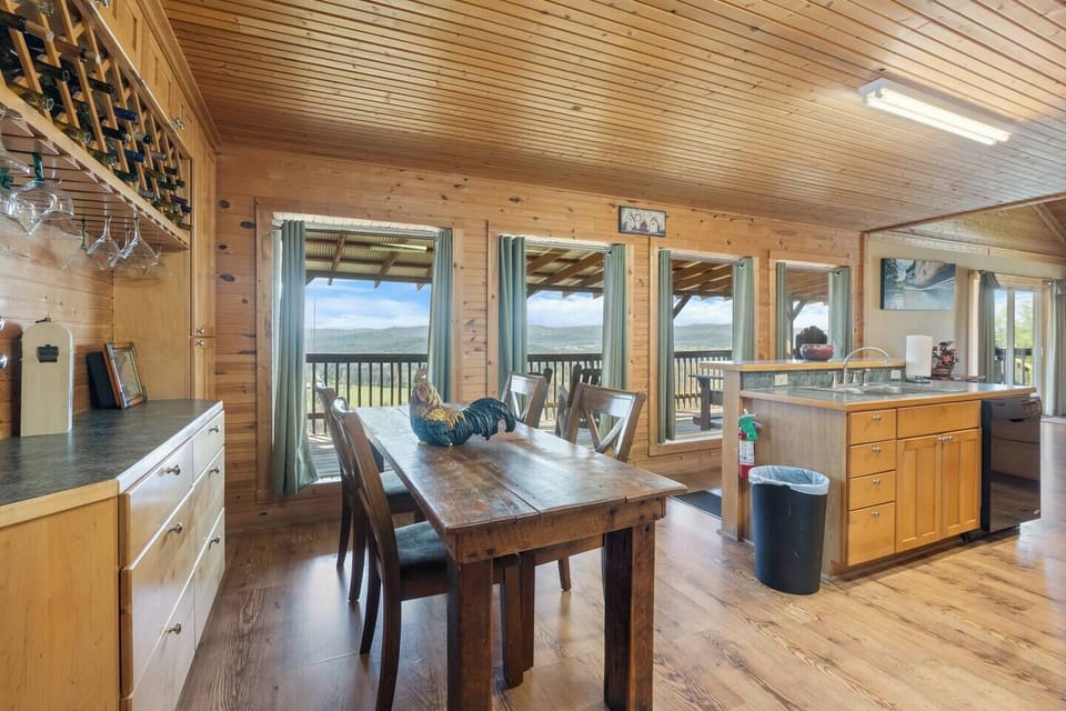 Located next to the kitchen, this breakfast nook is the perfect spot to enjoy a meal while taking in the beautiful views off the back deck.
