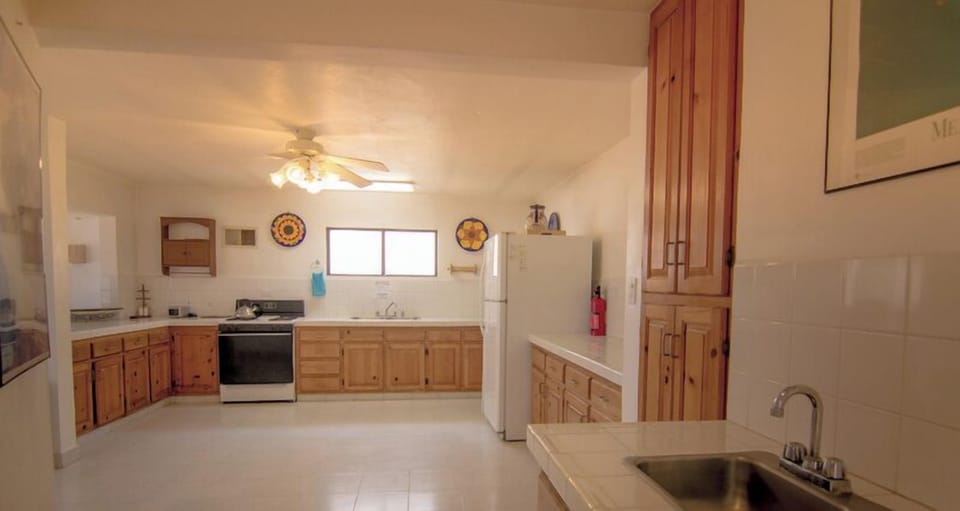 House, Multiple Beds, Patio, Beach View (E-10.5) | Private kitchen | Dining tables