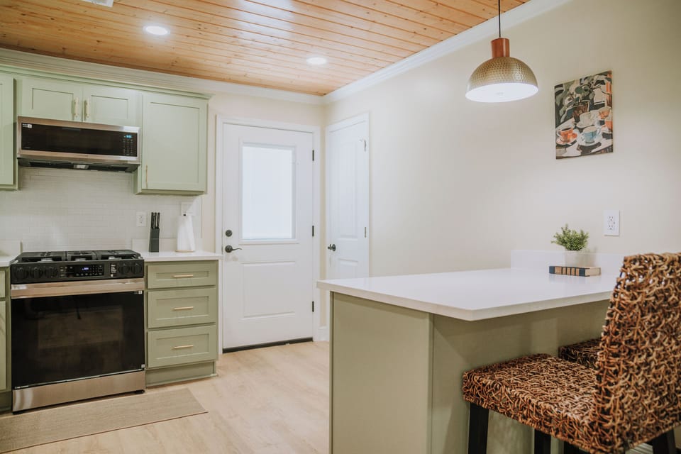 Full kitchen for cooking meals with island seating 