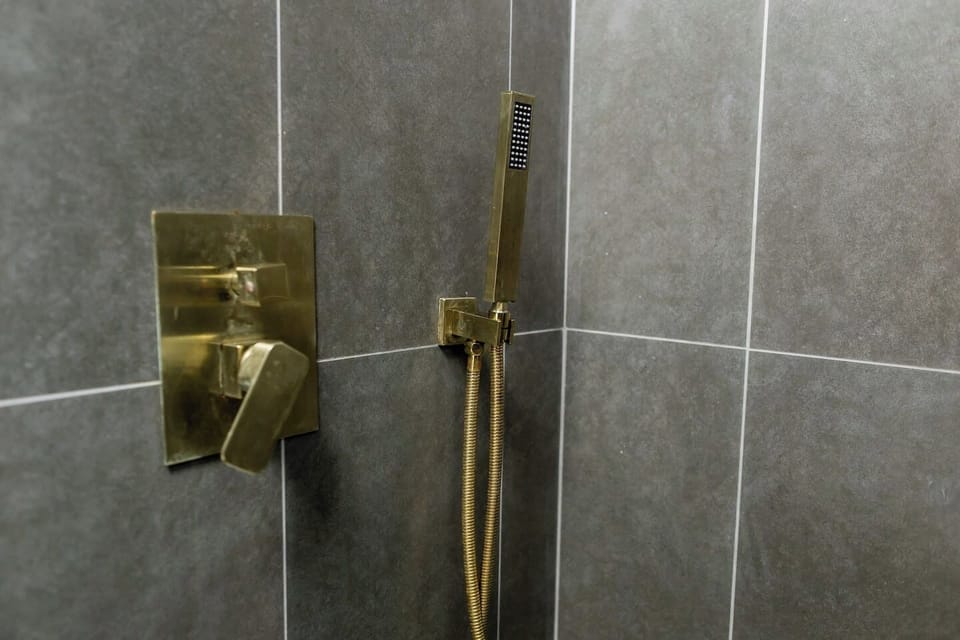 Clean lines, modern fixtures, and soothing design create the ultimate en suite bathroom retreat.