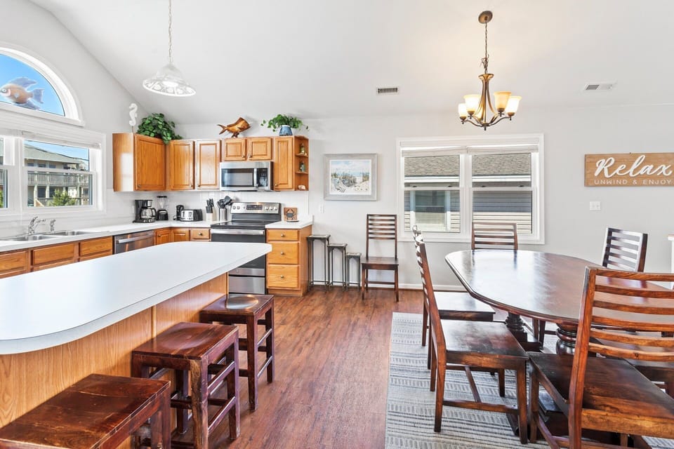 Dining Area: Gather for meals and conversation at the dining table with seating for six.