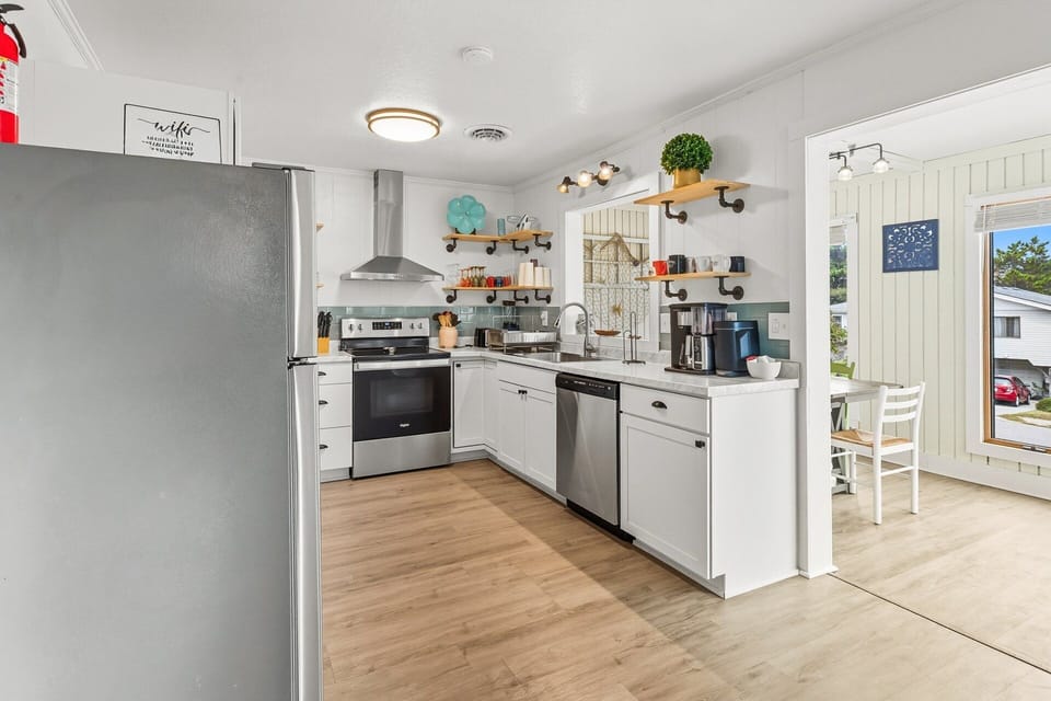 A fully equipped kitchen with updated appliances makes mealtime easy.