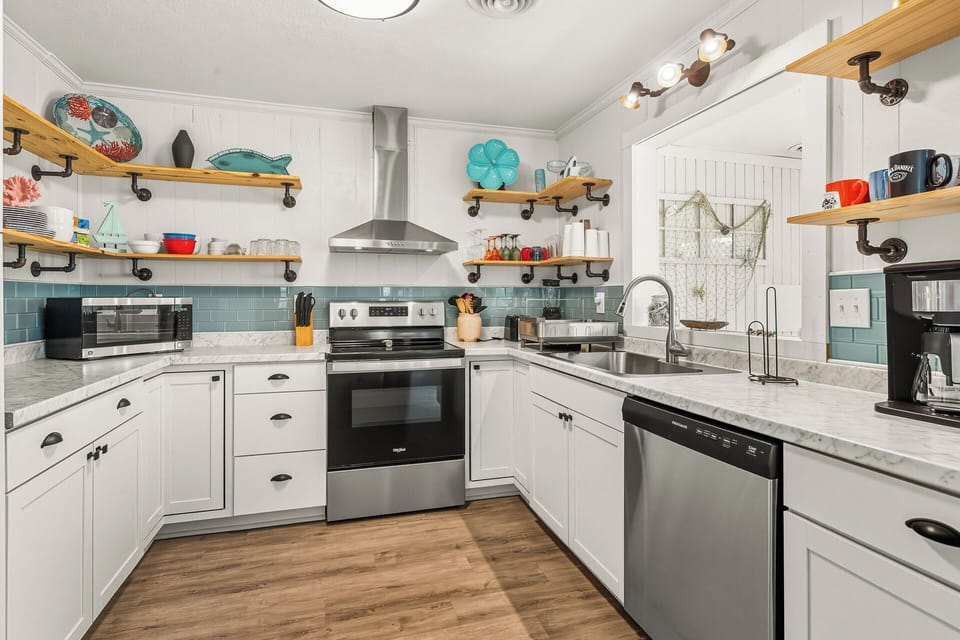 A fully equipped kitchen with updated appliances makes mealtime easy.