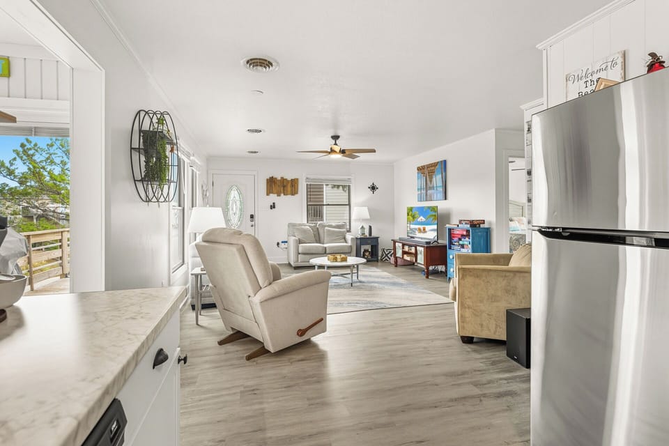 Bright, open-concept living area with plush seating and a Smart TV—perfect for family nights in.
