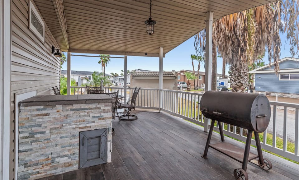 Fire up the charcoal grill on the covered deck