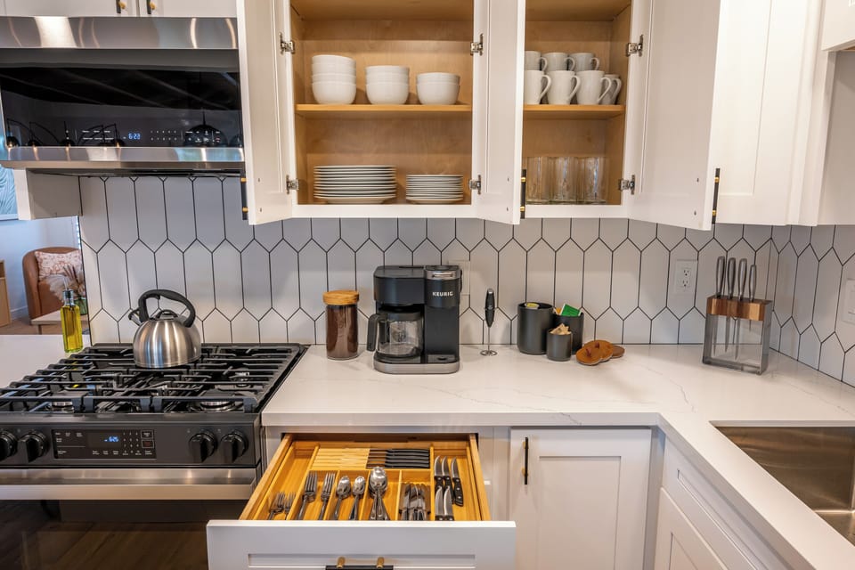 Wake to fresh coffee & cook with ease in a sleek, fully stocked kitchen.