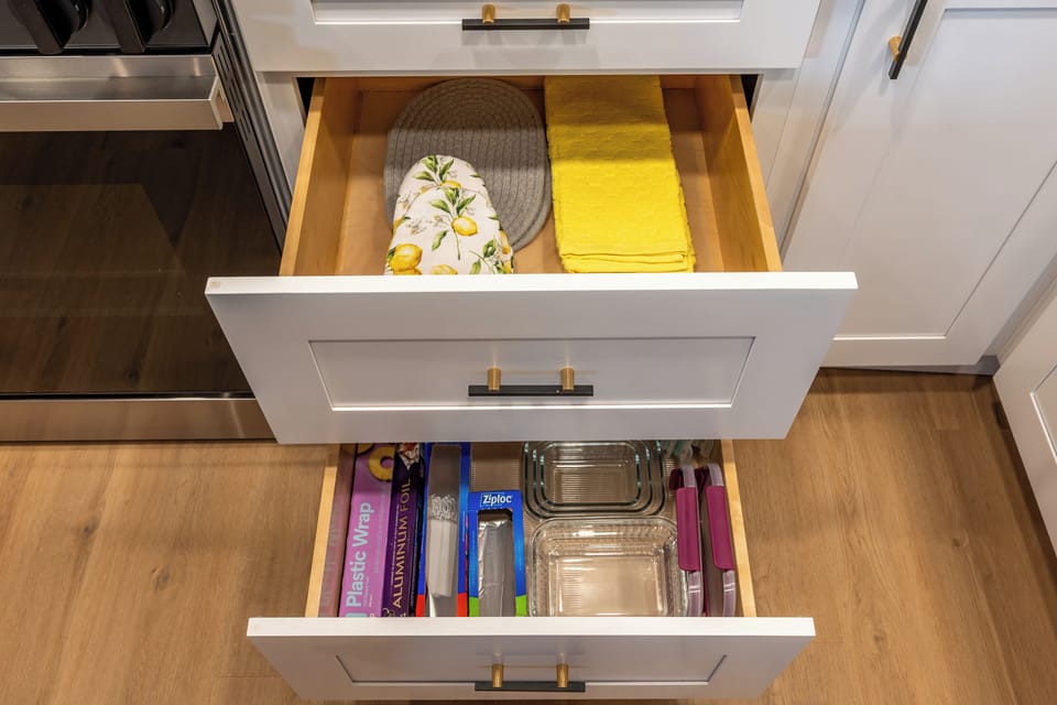 Behind each cabinet: luxe touches like towels, wraps & kitchen must-haves.