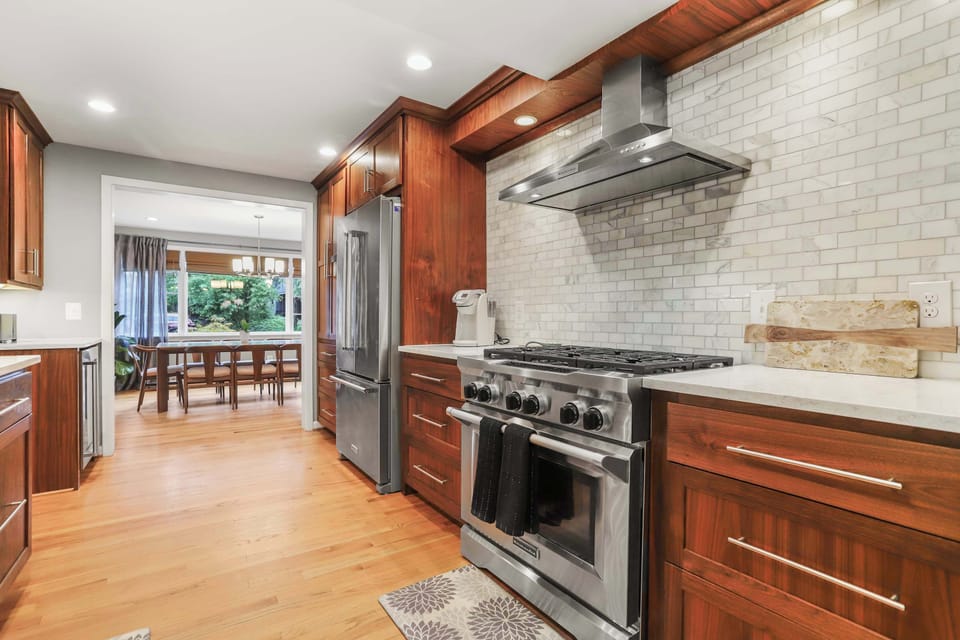 Full kitchen with a view of dining area.