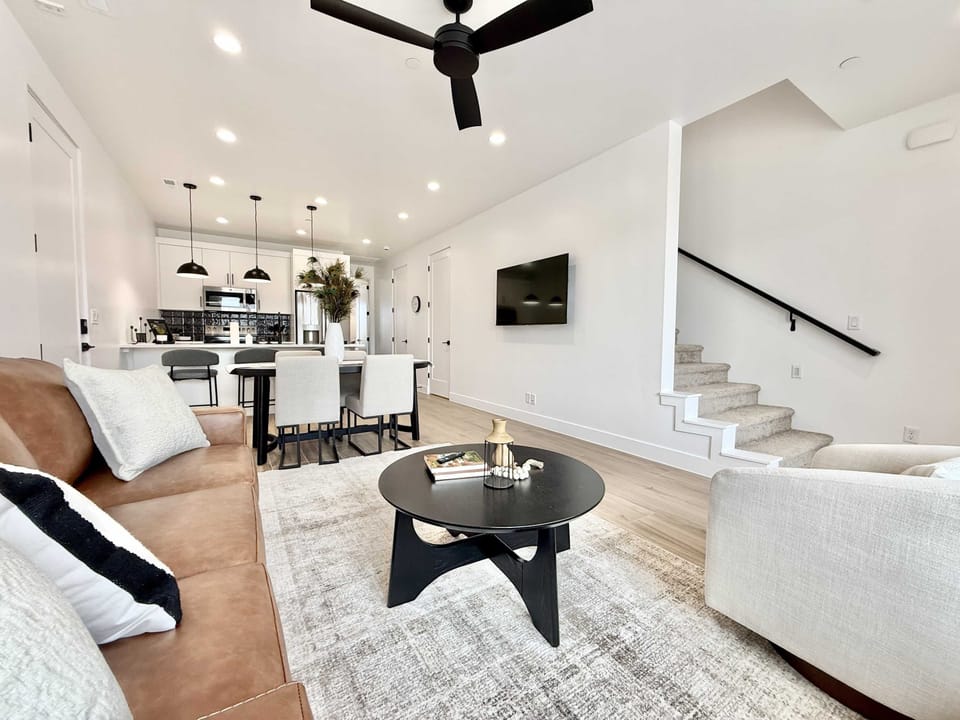 Relax in the living room, or gather with friends and family in the open concept floor plan complete with high end furnishing and designer decor.