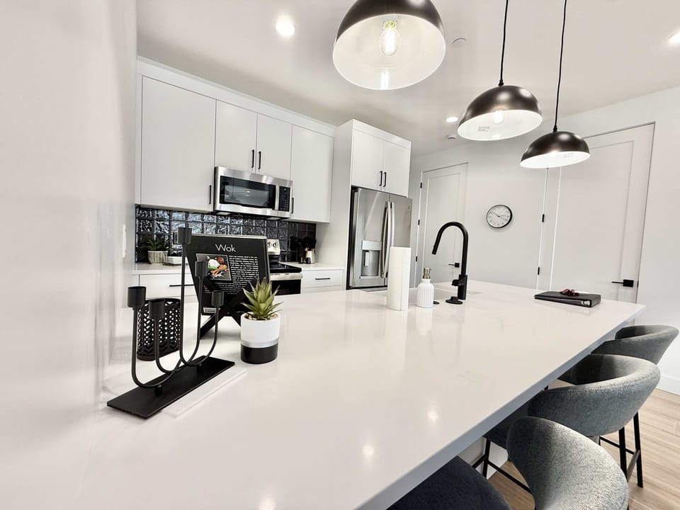 Open and airy, with plenty of counter space, the kitchen is fully appointed and ready for you to whip up your favorite meals.