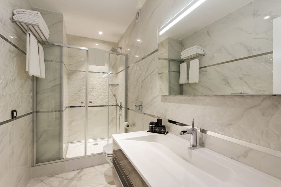 Shower, free toiletries, slippers, towels