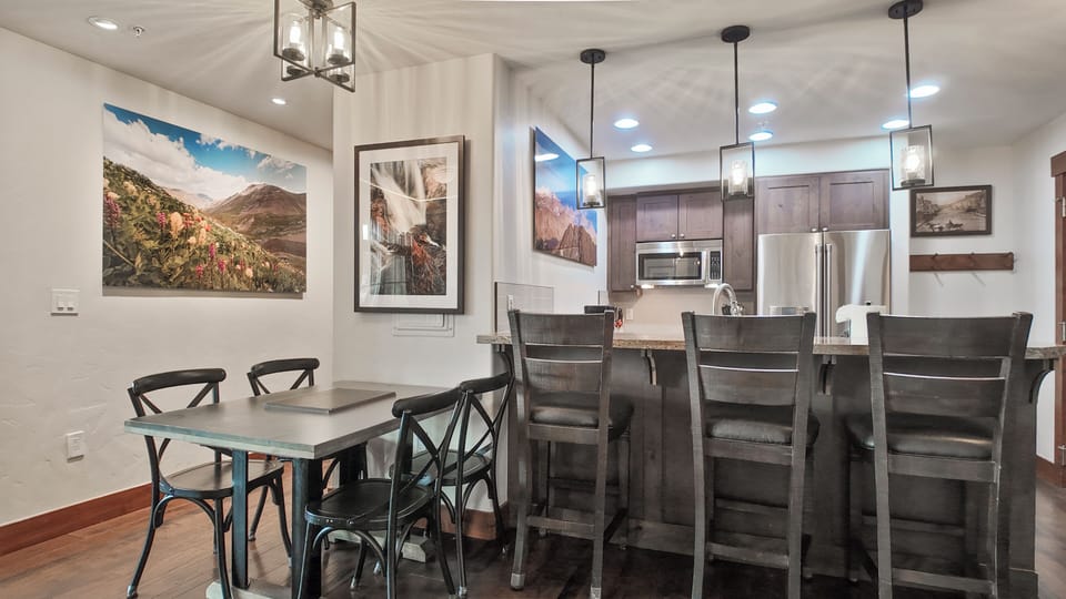 Kitchen with breakfast bar and dining table