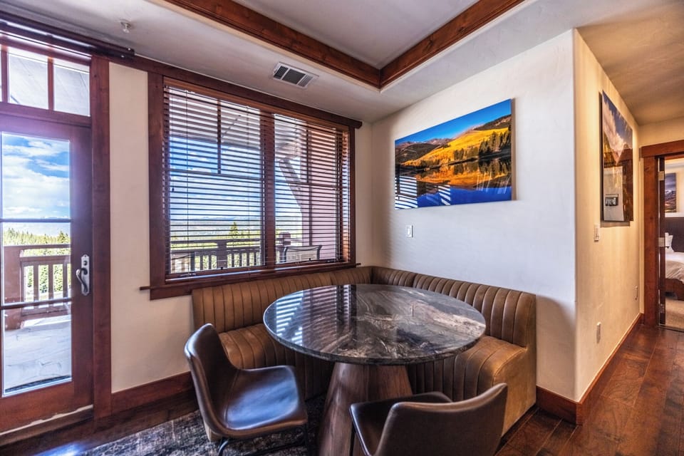 Intimate Banquette Dining with Mountain & Balcony Views
