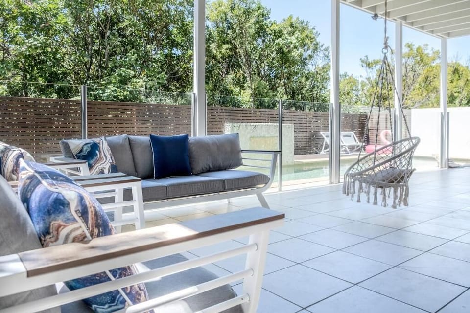 Outdoor lounge beside pool