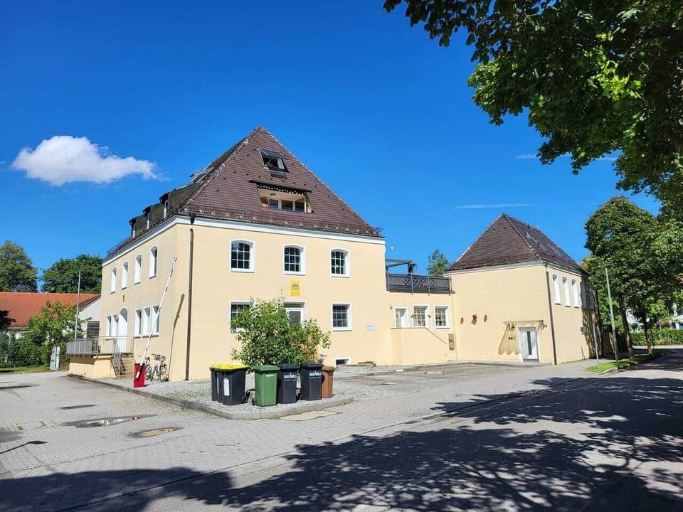 The Apartment is inside the smaller building on the right.