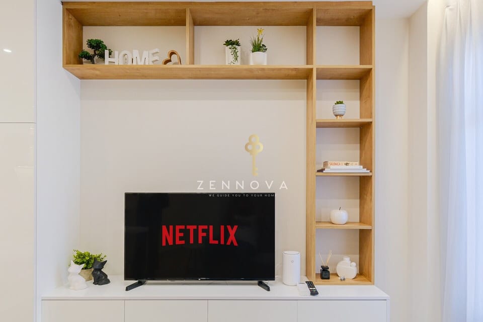 Deluxe Apartment, City View | Living area | Flat-screen TV