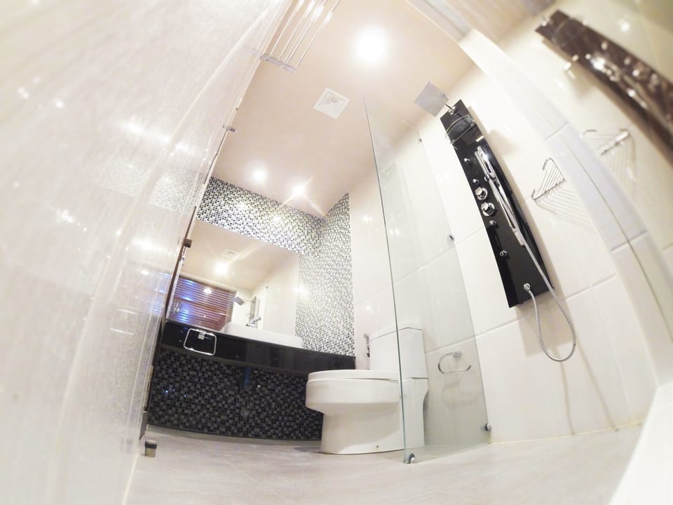Deluxe Double or Twin Room, 1 King Bed, Refrigerator, Beachfront | Bathroom | Shower, rainfall showerhead, free toiletries, hair dryer