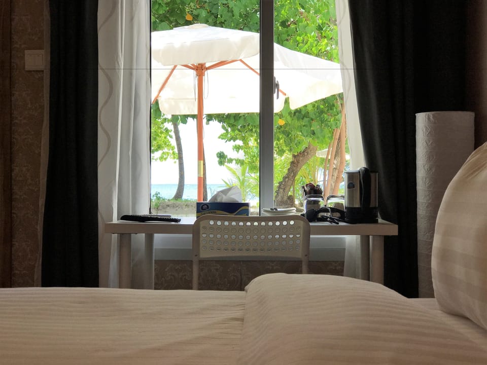 Economy Double Room, 1 King Bed, Sea View, Beachfront | Premium bedding, minibar, in-room safe, individually decorated