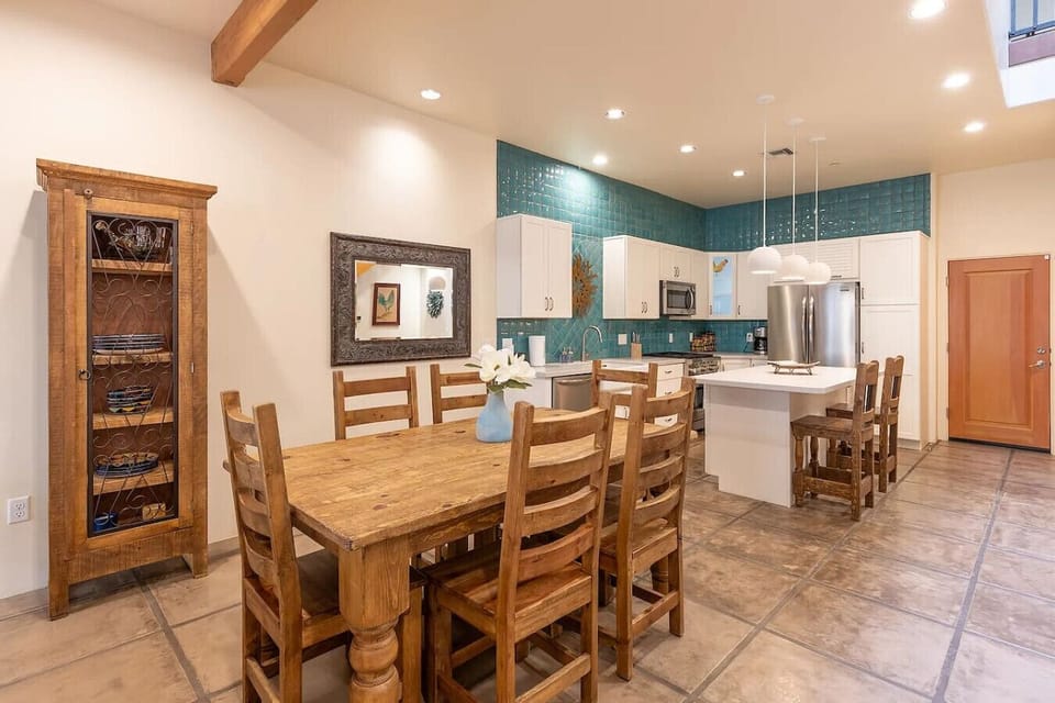 Beautifully decorated open-concept kitchen and dining area designed for gathering and entertaining