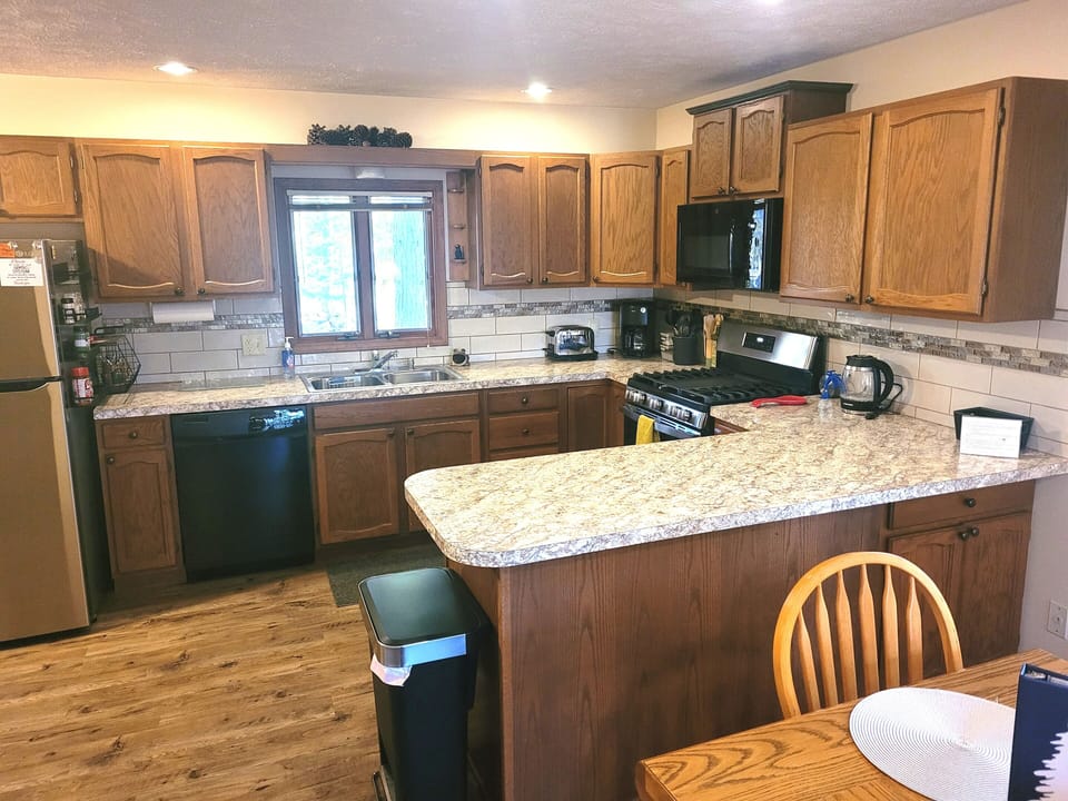OVERVIEW:  The home has a large and modern kitchen with all appliances including a dishwasher.  A good supply of cooking and dining utensils is also included.