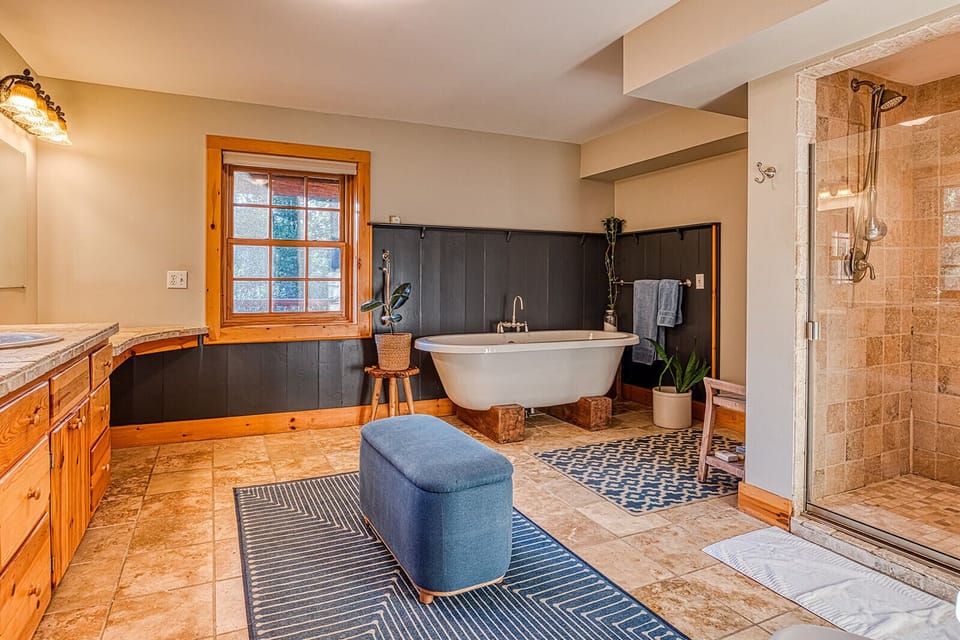 Primary bathroom with soaking tub and walk in shower