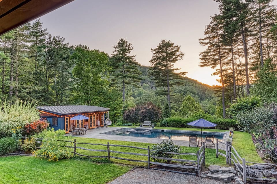 A pool  and pool house with a view. Enjoy the heated, saltwater pool with integrated hot tub - open seasonally.