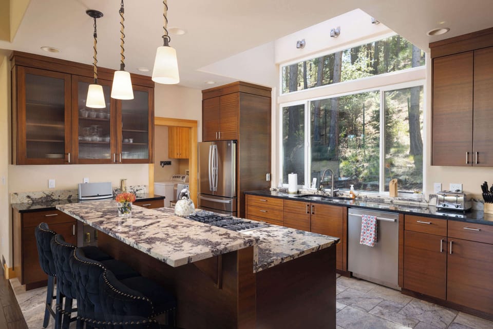 The elegant kitchen offers ample space & all the comforts of home​
