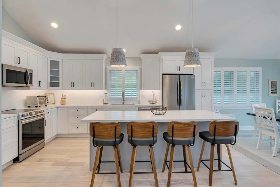 Prepare meals with ease in your gourmet kitchen featuring high-end appliances.