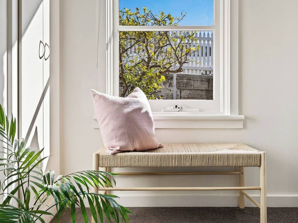 Bask in the soft light of the window seat, a tranquil spot for reading or enjoying your morning cuppa.