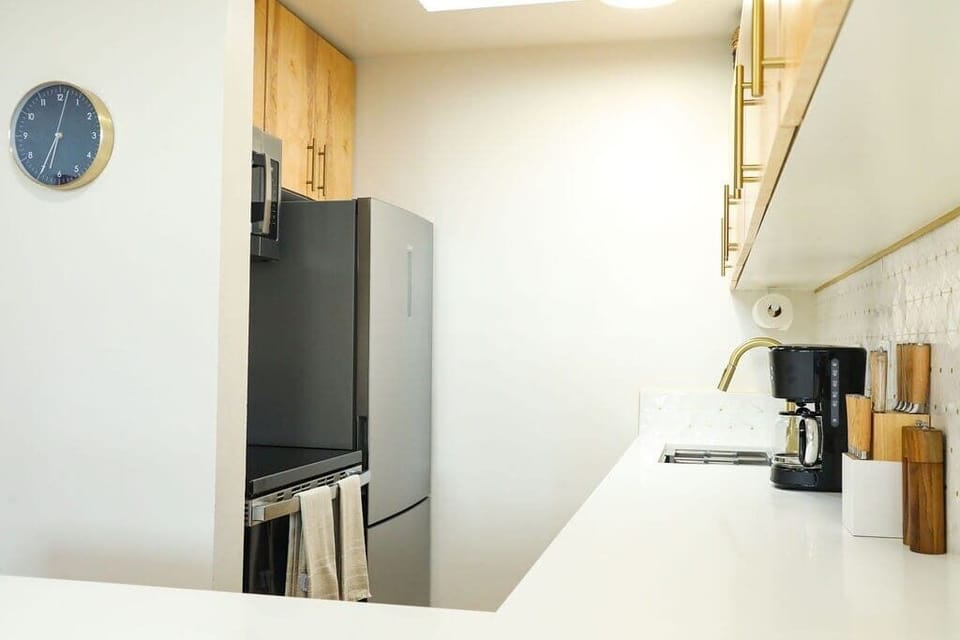 Hillside Hideaway II ~galley style with an island quartz countertop