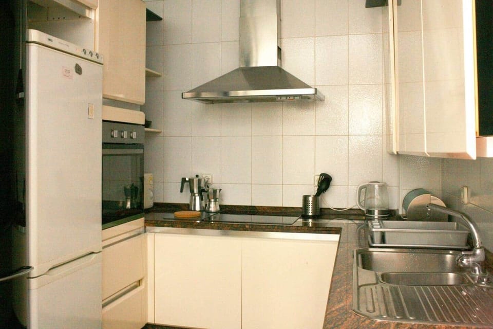 The retro kitchen is equipped with a fridge/freezer, oven, microwave, toaster, coffee pots, instant kettle, and dishwasher. Perfect for catering gatherings and serving your family and friends. 