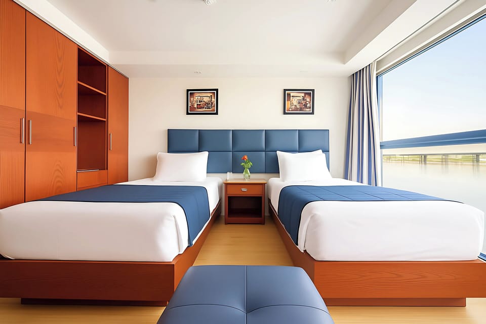 Deluxe Suite, Balcony, River View | In-room safe, laptop workspace, blackout drapes