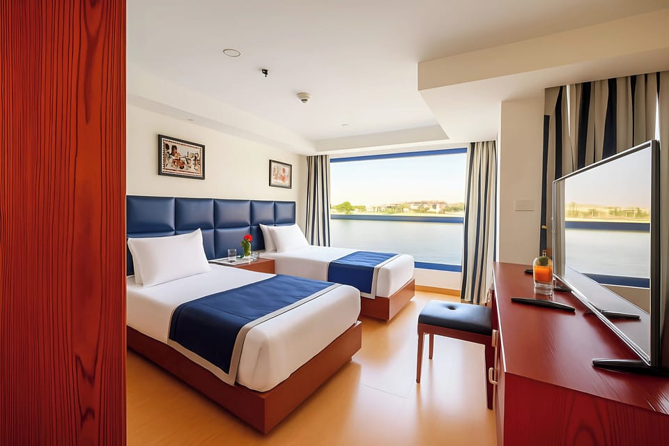 Deluxe Suite, Balcony, River View | In-room safe, laptop workspace, blackout drapes