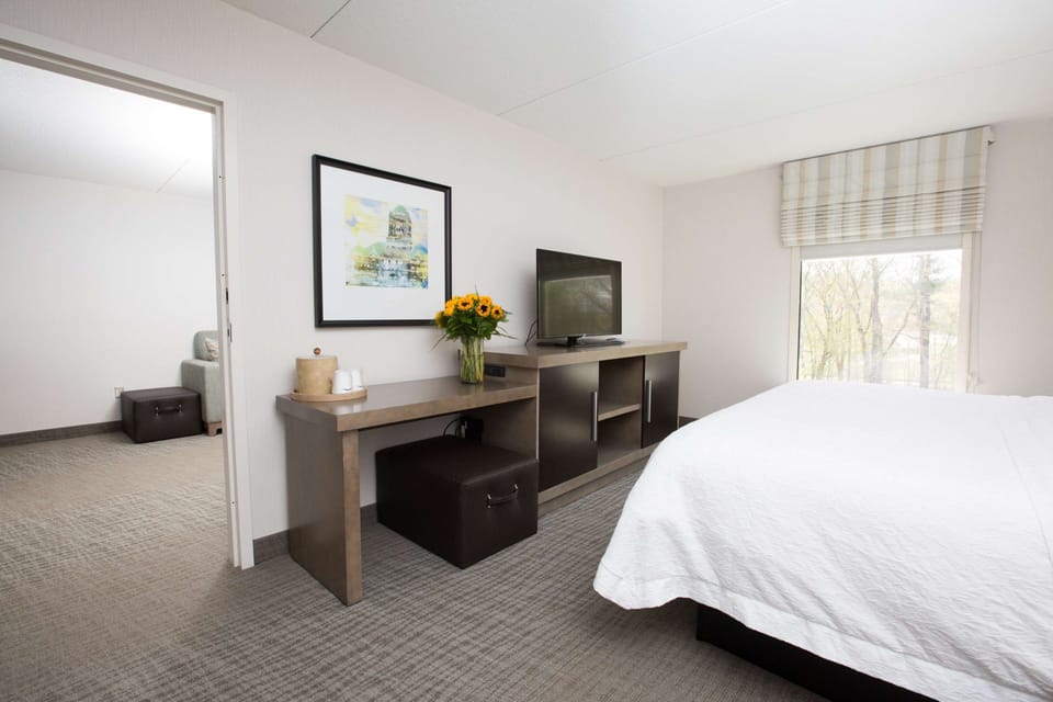 Premium bedding, desk, laptop workspace, blackout drapes