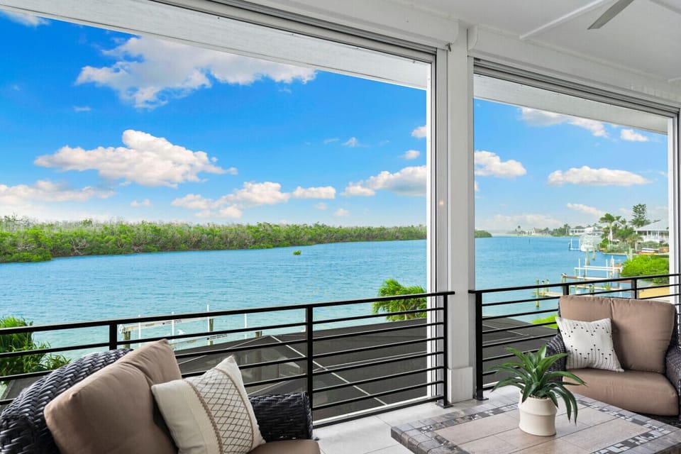 Sip morning coffee on the balcony overlooking the water